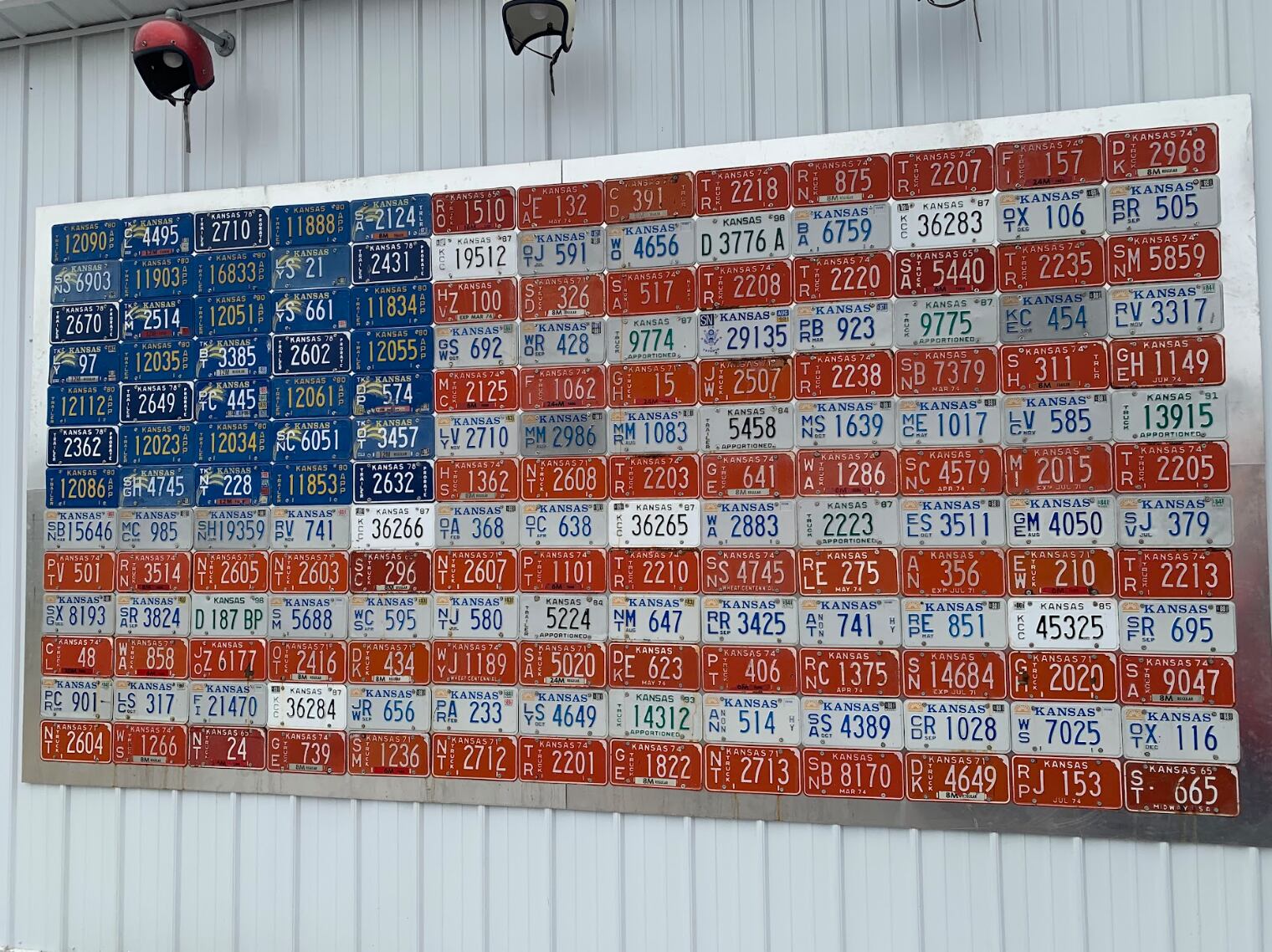 Folk art made from reused license plates depicts the American flag.