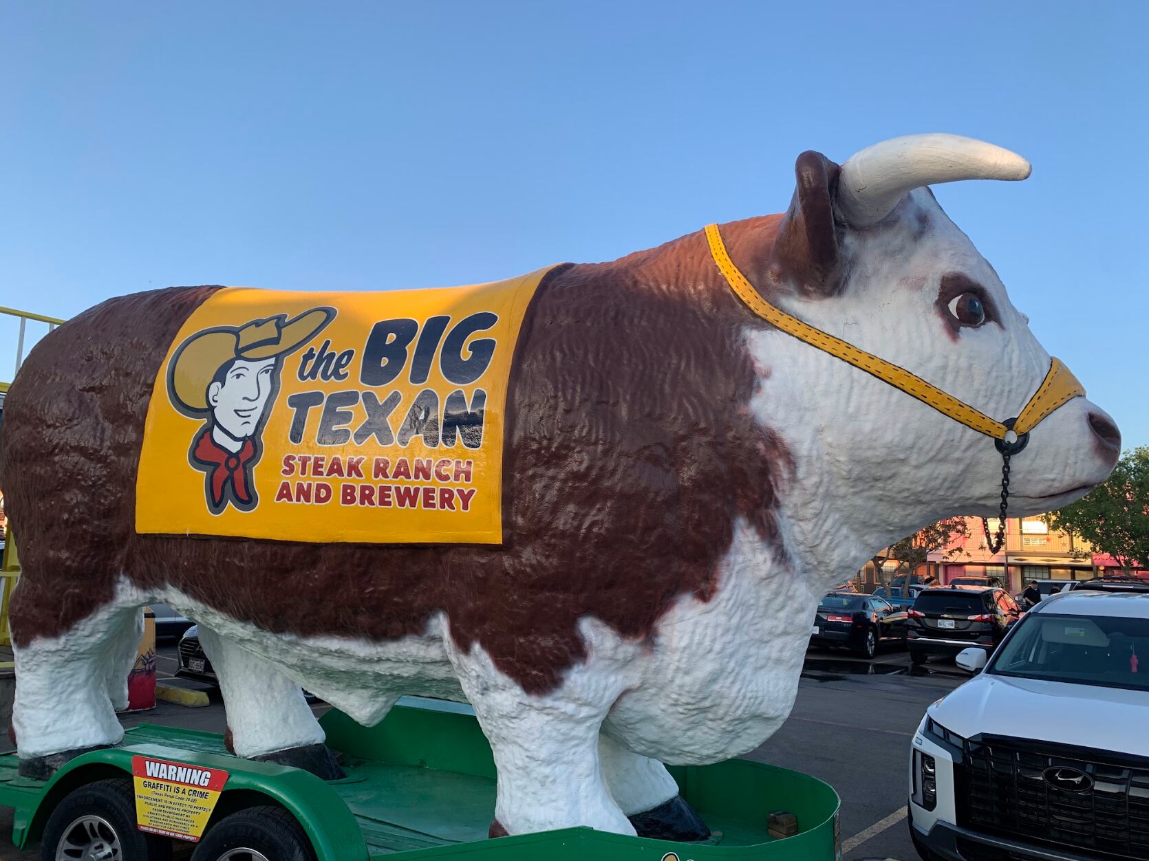The famous The Big Texan Steak Ranch & Brewery in Amarillo is guarded by a larger than life fiberglass cow.