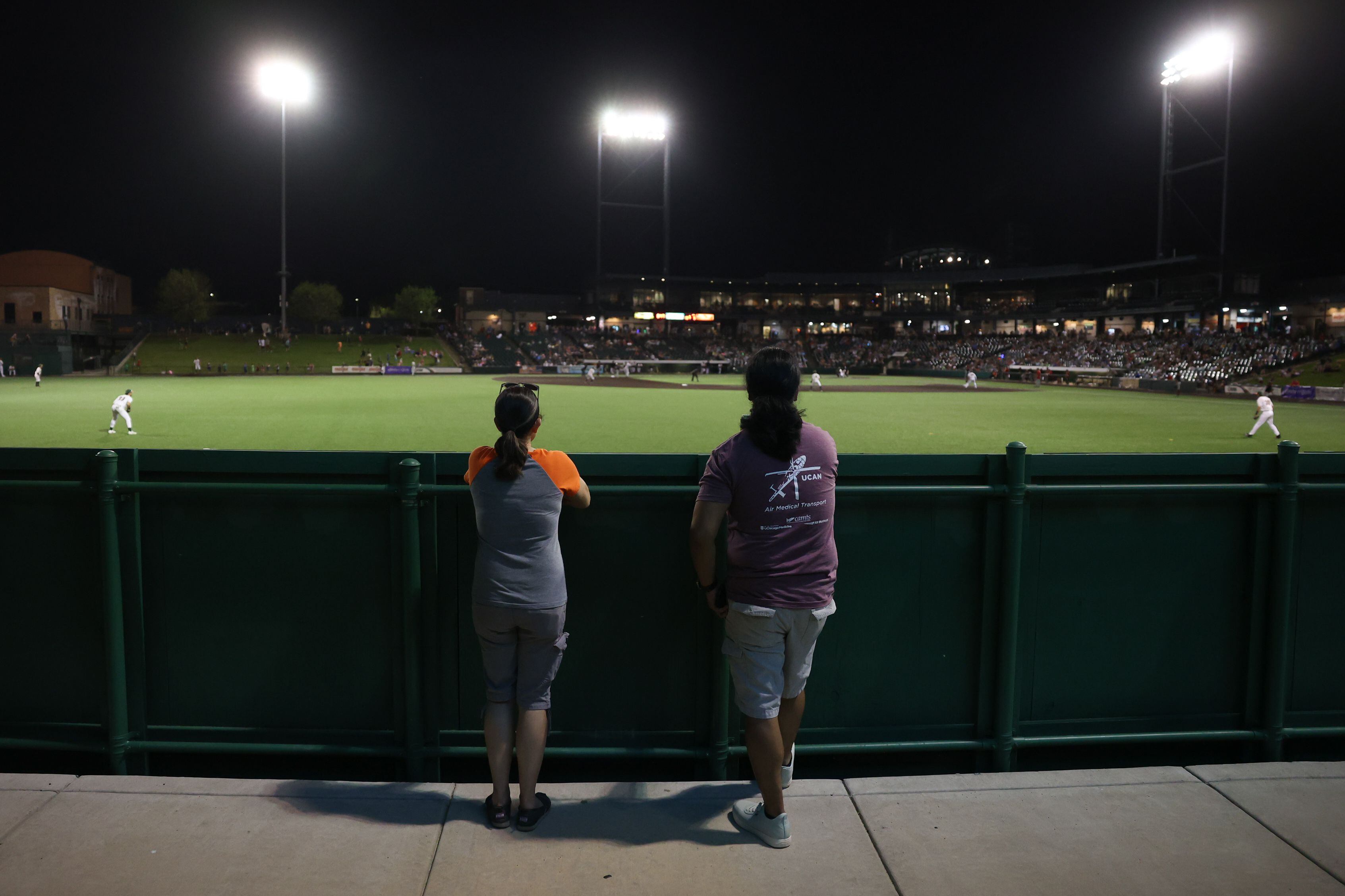 Laura Nurczyk and Randy Pachao, of Joliet, watch the Joliet Slammers take on the Ottawa Titans from left field. Friday, May 13, 2022, in Joliet.