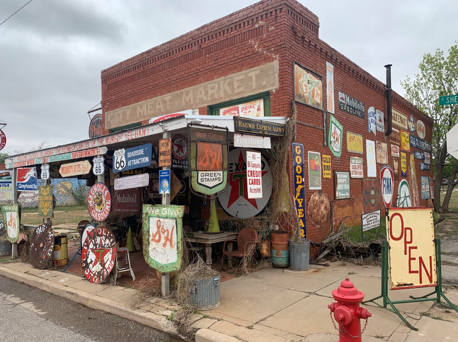 The Sandhill Curiosity Shop in Erick, OK is where you'll find Harley Russell, the famed 'hillbilly hoarder' of Route 66 who is believed to have been the inspiration of the character Mater in Pixar's Cars.